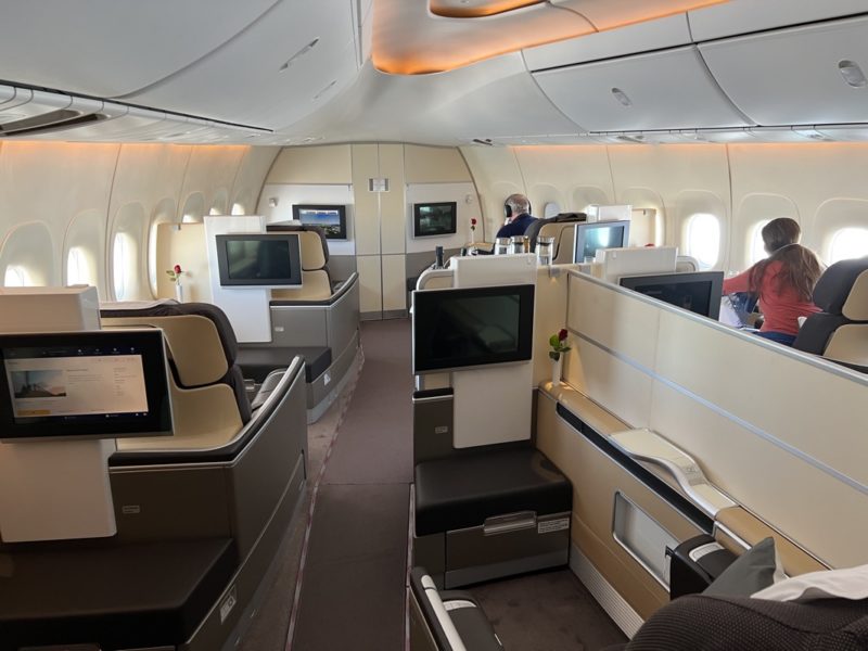 a room with tvs and seats in an airplane