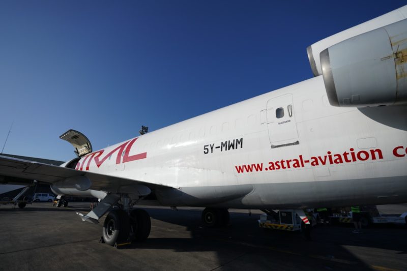 a white airplane with red writing on it