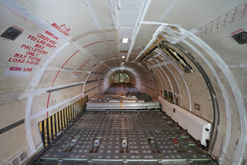 a long tunnel with metal floor