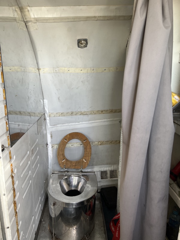 The B727 has a simple toilet installed with curtain as divider.