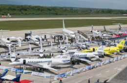 a group of airplanes on a runway