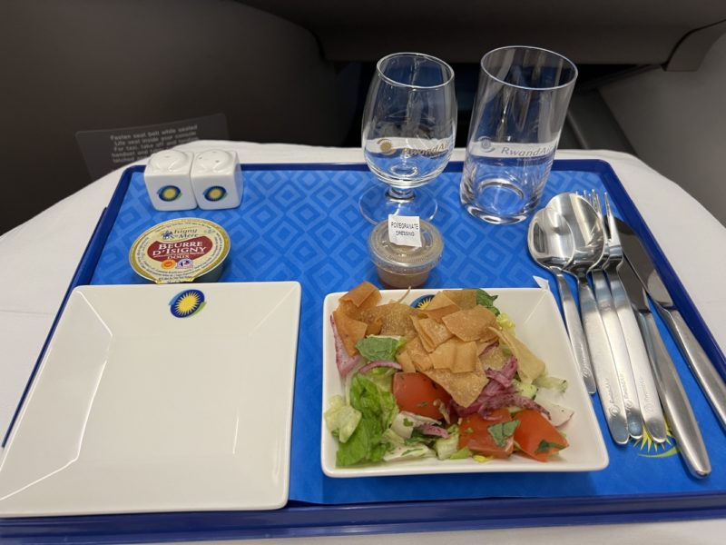 a tray with food and glasses on it