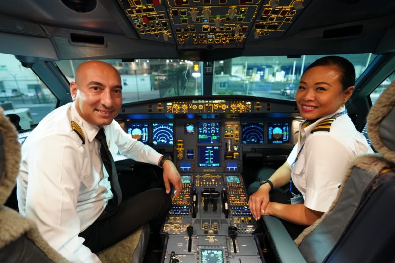 a man and woman in a cockpit