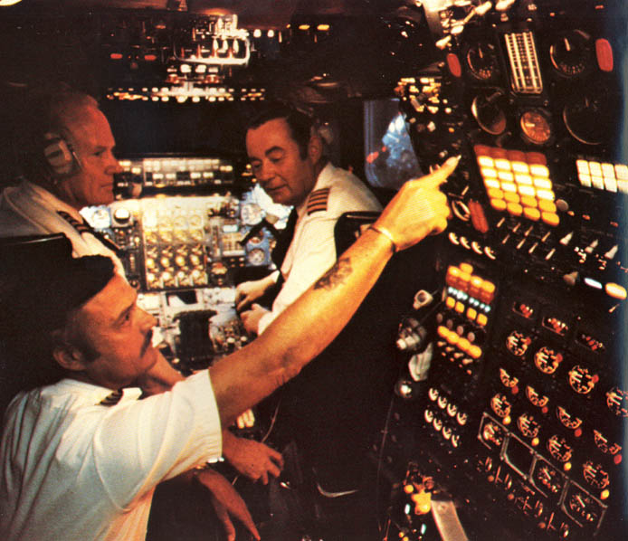 a group of pilots in a control room
