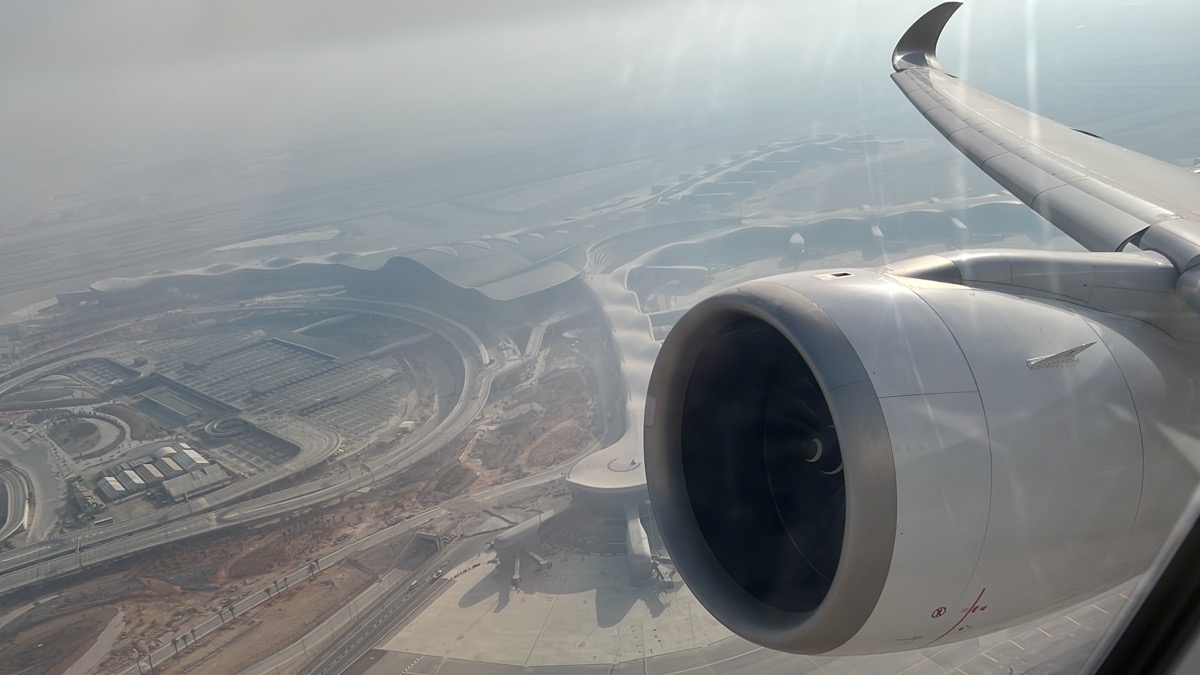 an airplane wing and engine in the air