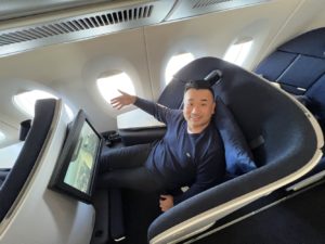 a man sitting in a chair in an airplane