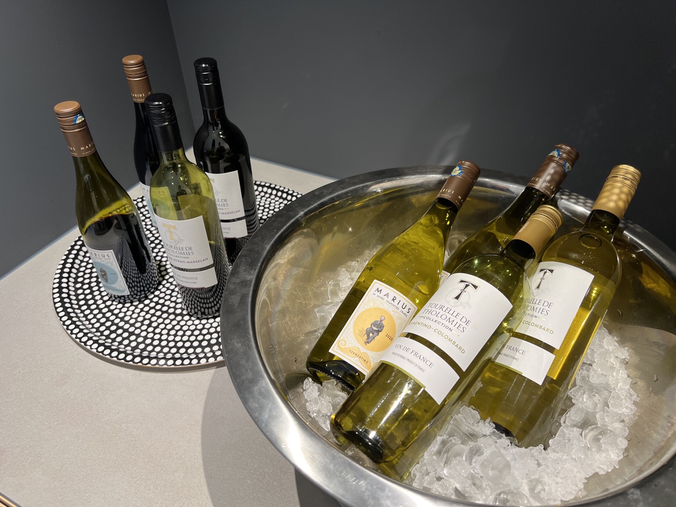 a group of bottles of wine in a bucket of ice