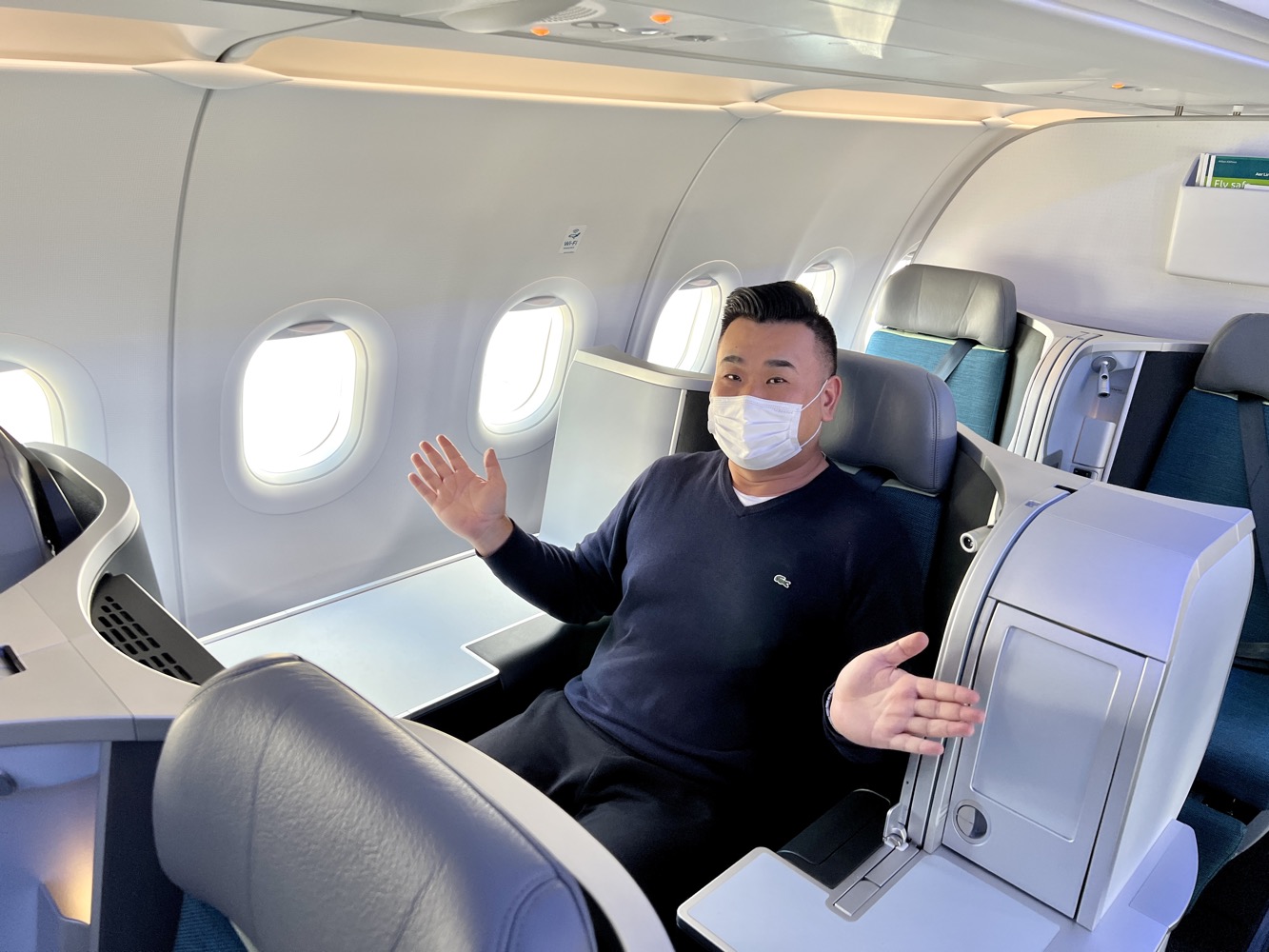 a man in a mask on an airplane