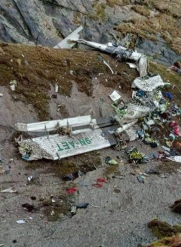 a crashed airplane on a hill