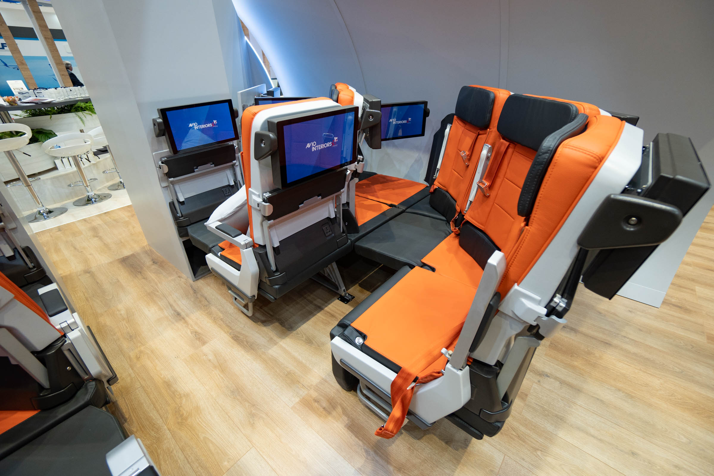 an airplane seat with monitors
