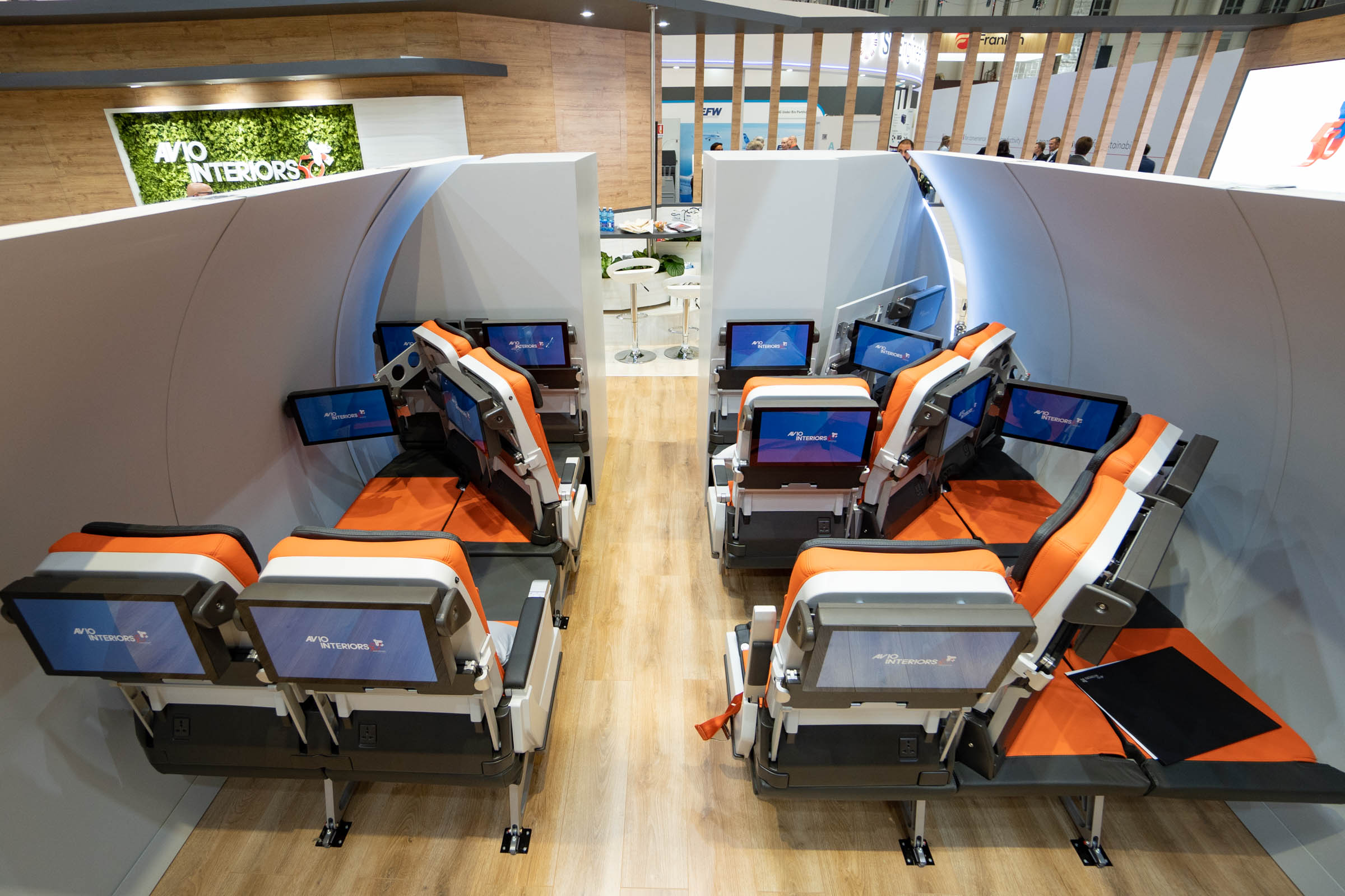 a group of chairs with computers in a room