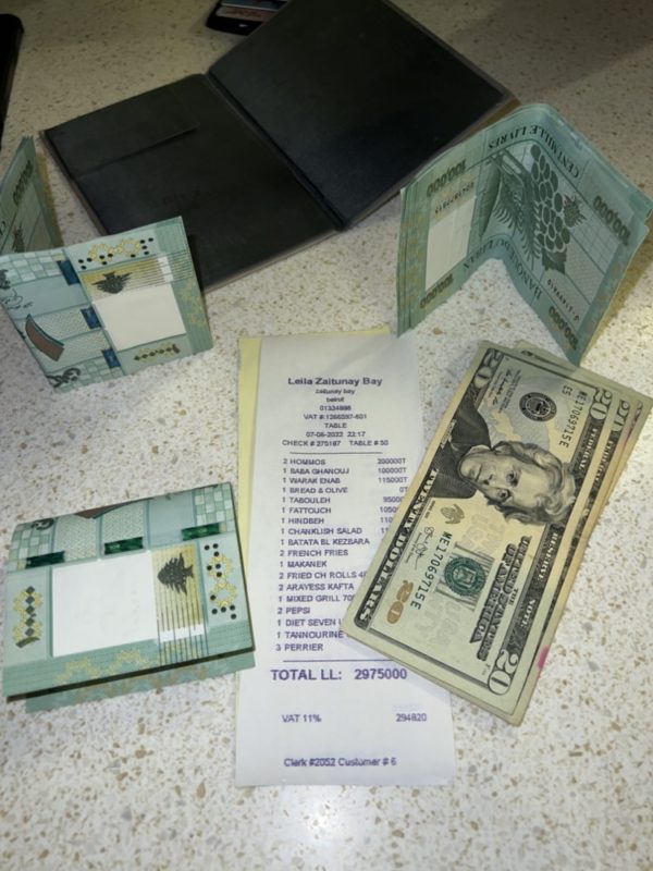 a bill and money on a table