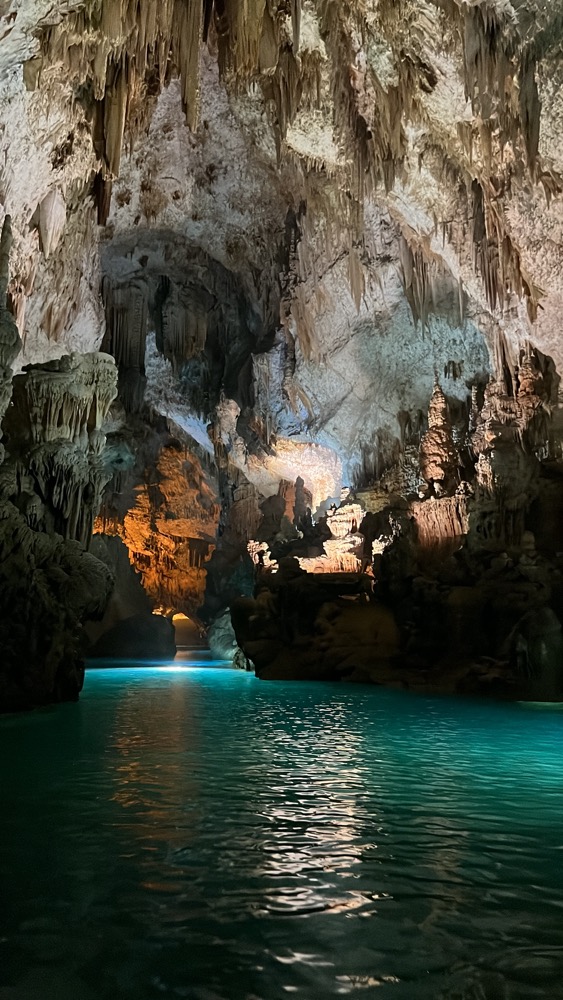 a cave with a body of water