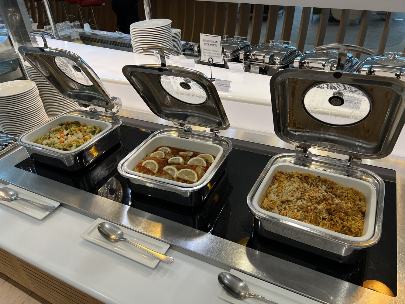 a row of food containers with open lids