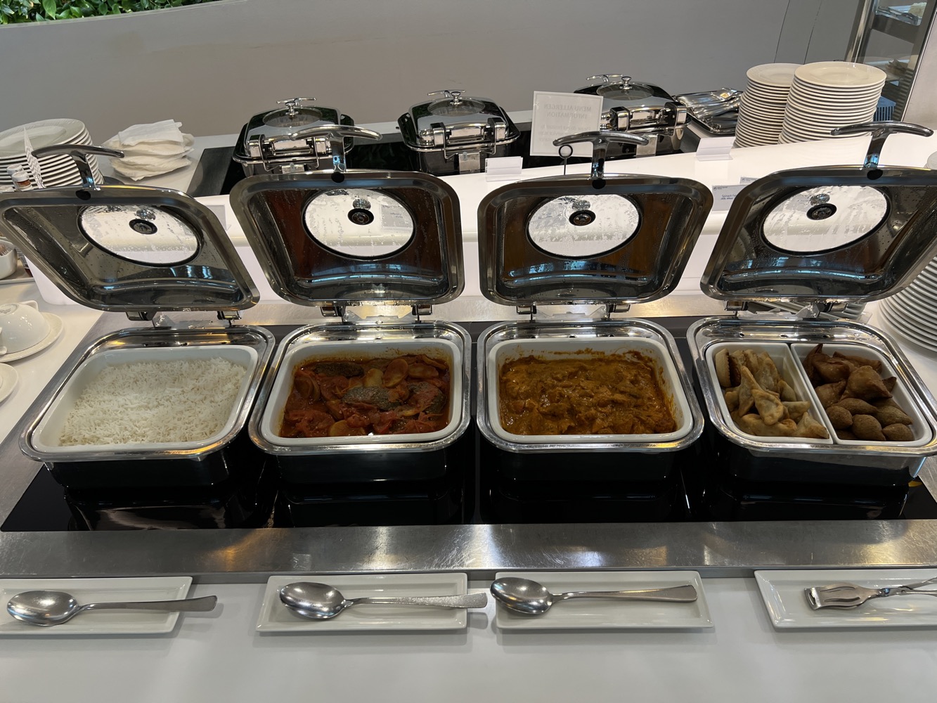 a row of food containers with lids