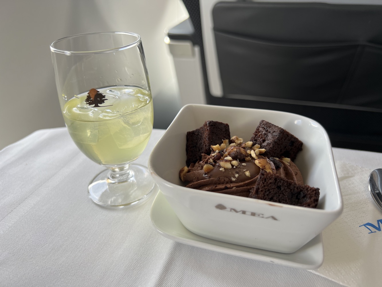 a bowl of brownies and a glass of liquid