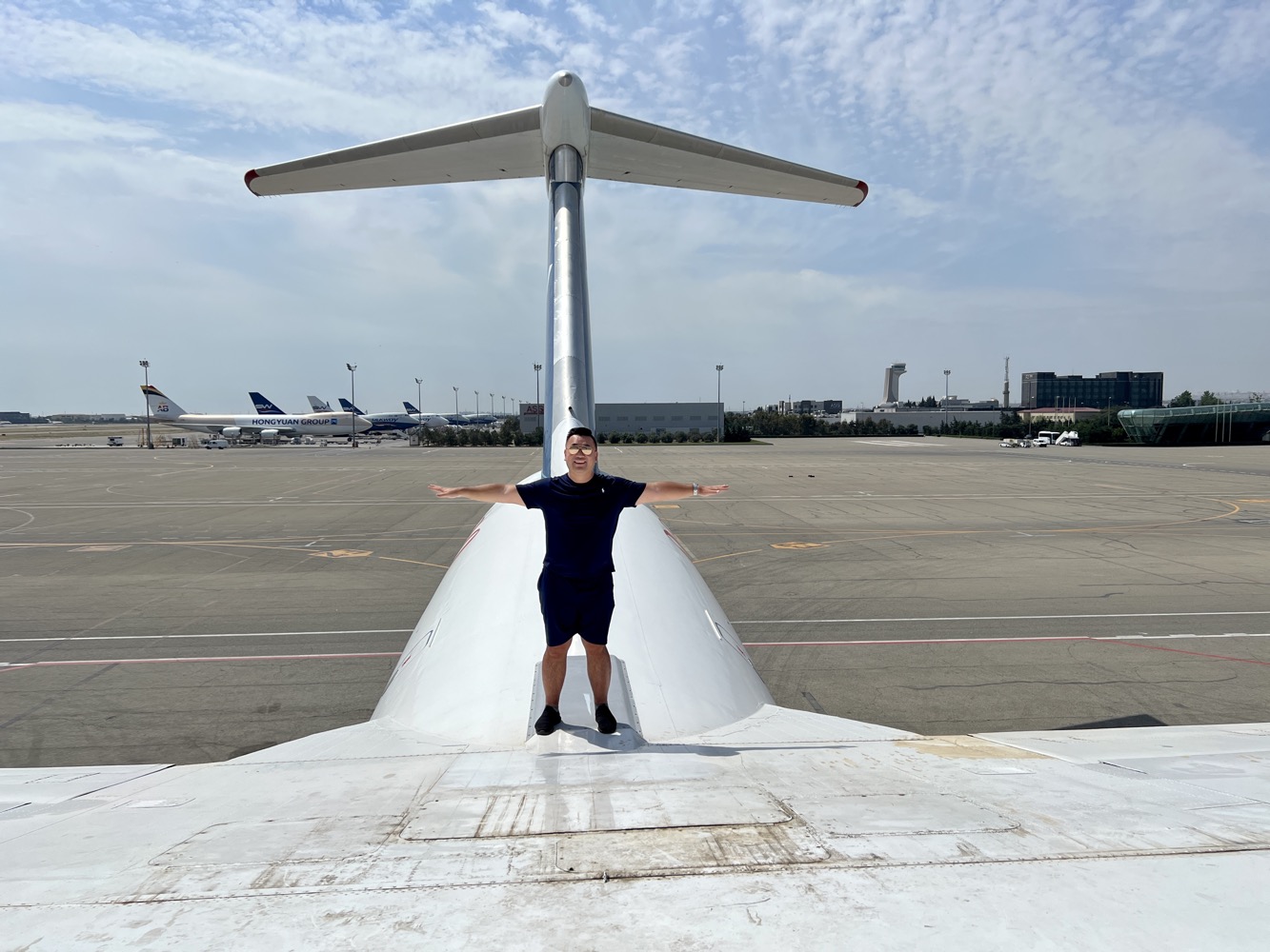 a man standing on the wing of an airplane