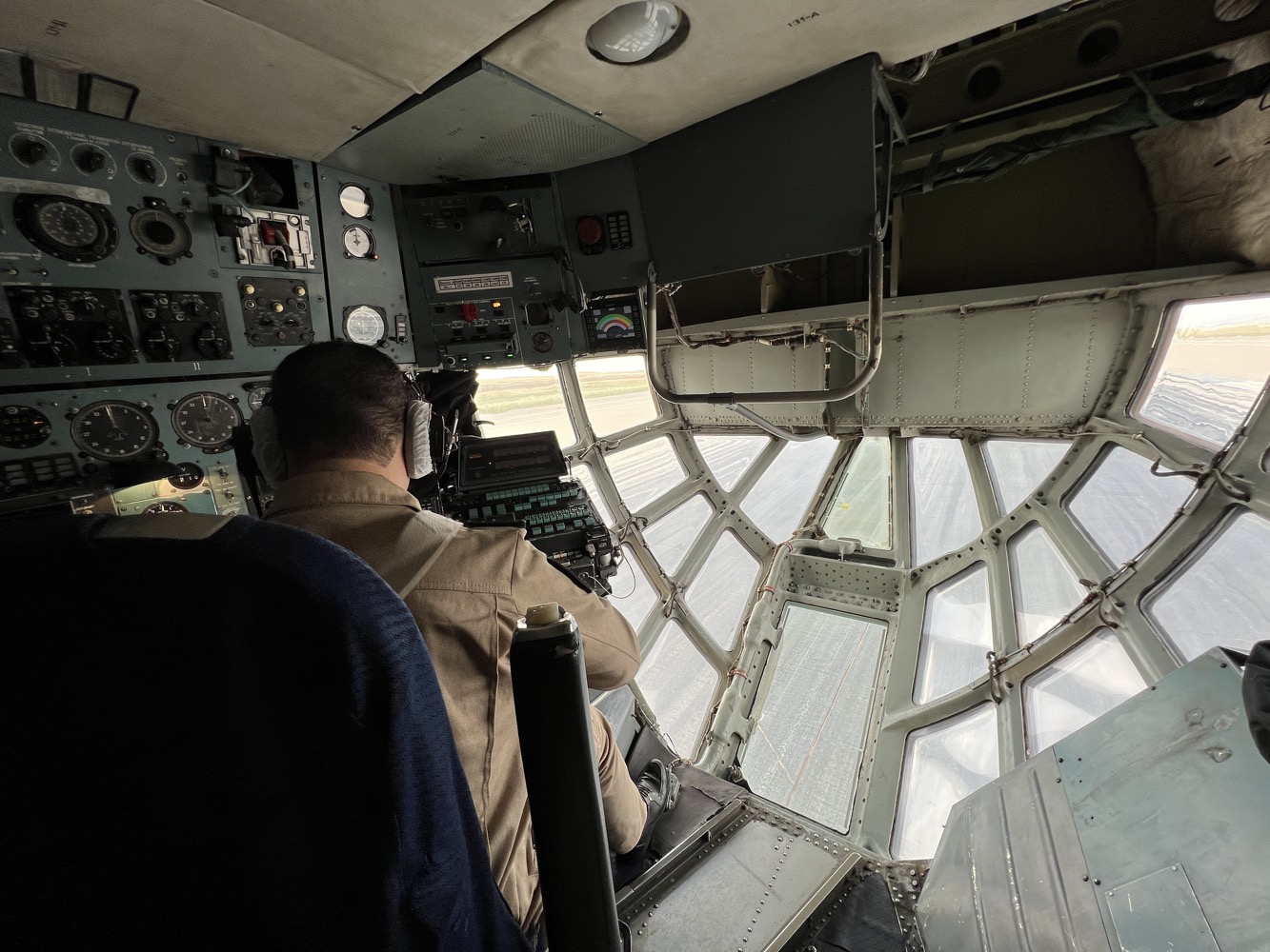 a man in a cockpit of a plane