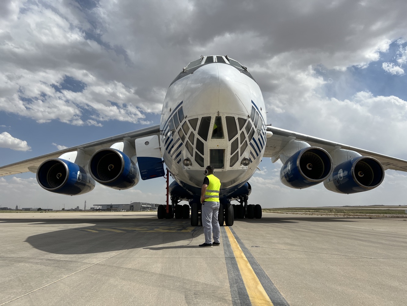 a man standing next to a large airplane
