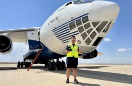 a man standing in front of a plane