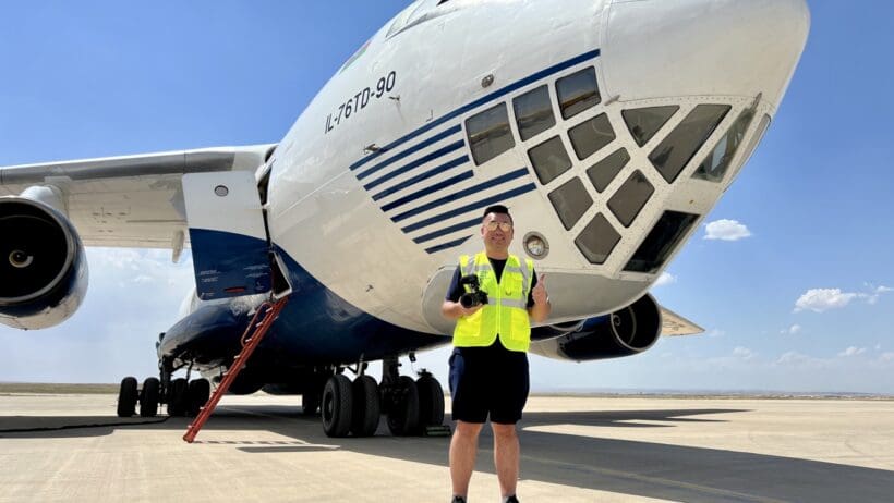 a man standing in front of a plane