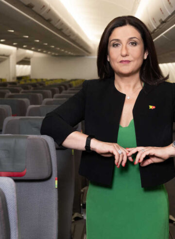 a woman standing in an airplane