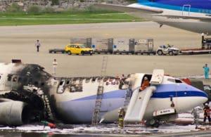 a crashed airplane on the runway