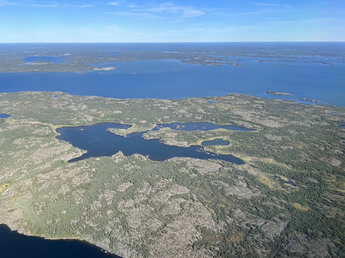 an aerial view of land and water