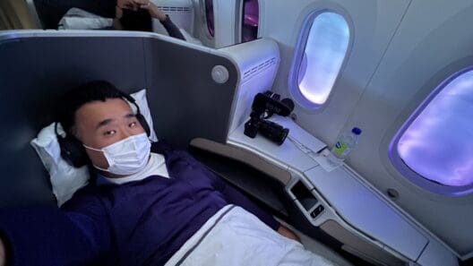 a man lying in a chair with a mask on