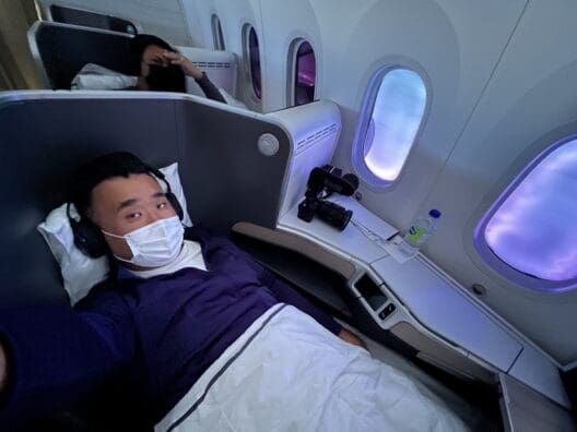 a man lying in a chair with a mask on