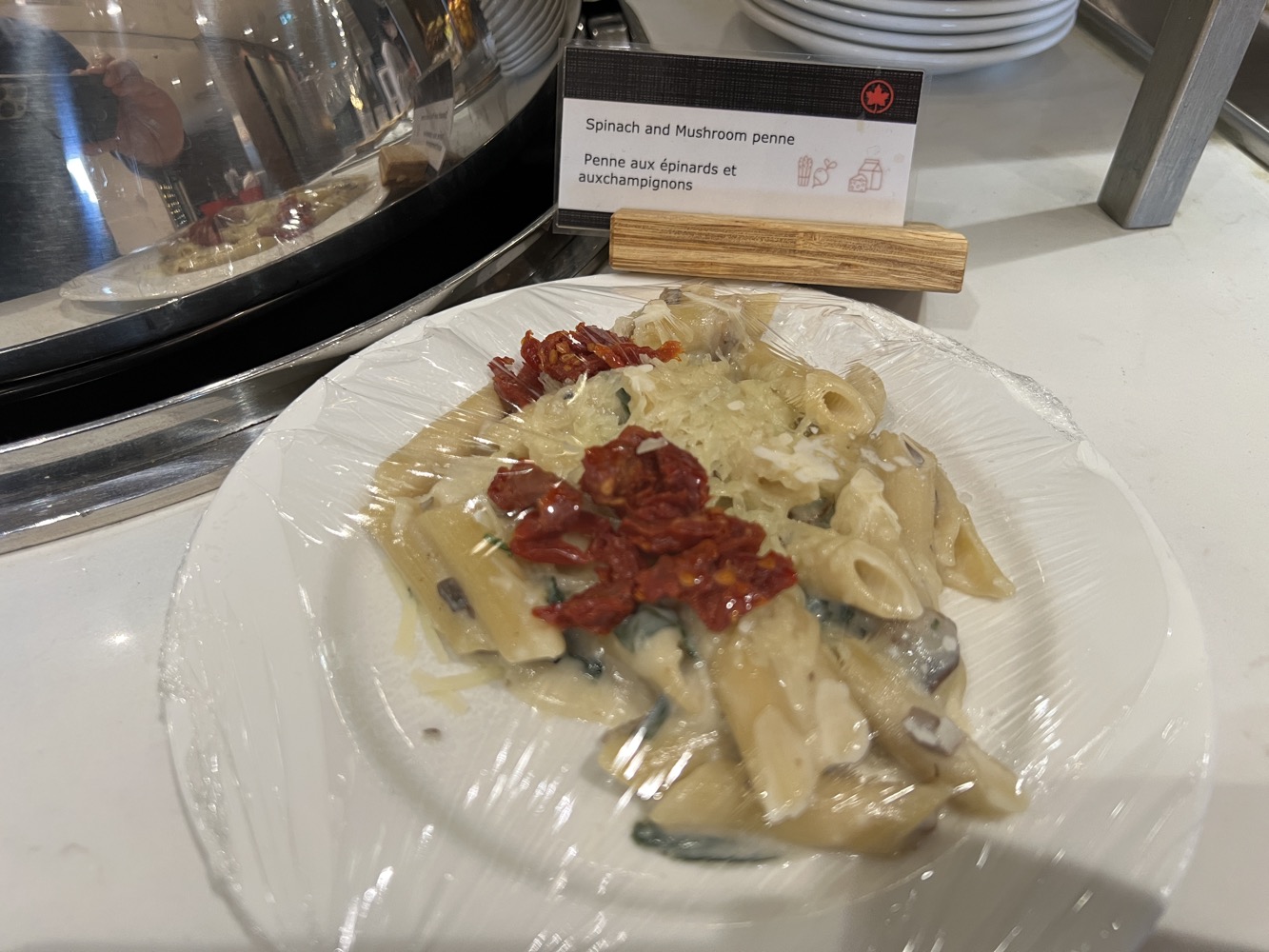 a plate of pasta with dried tomatoes on it