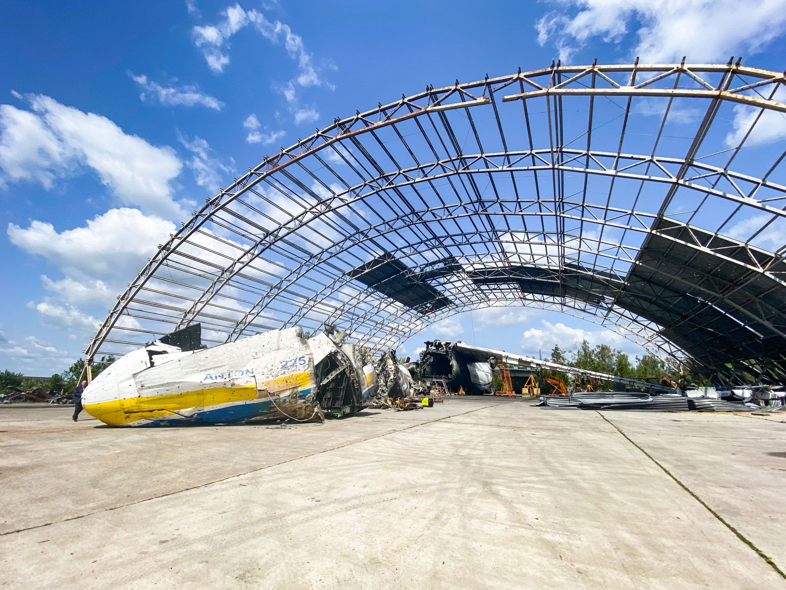 a large metal structure with a broken airplane