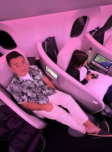 a group of people sitting in chairs on an airplane