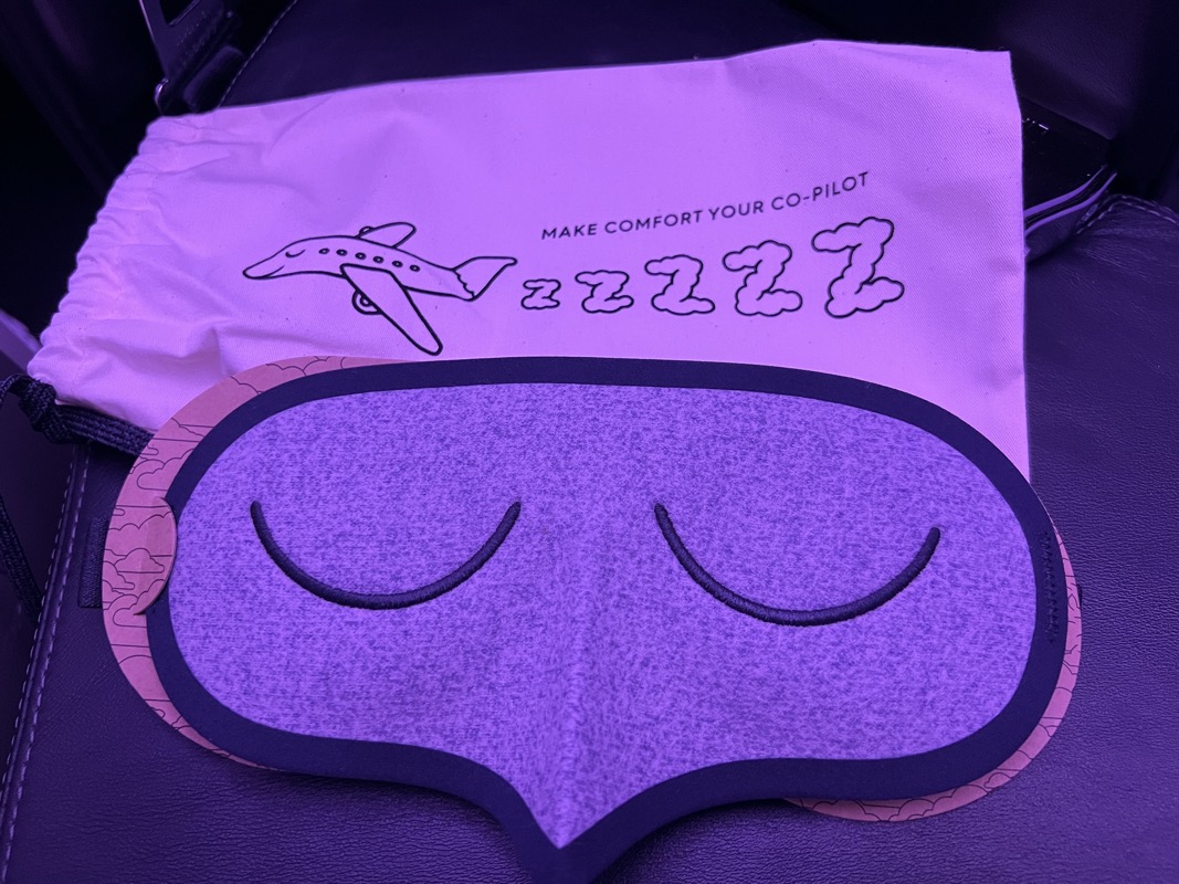 a sleeping mask on a bag