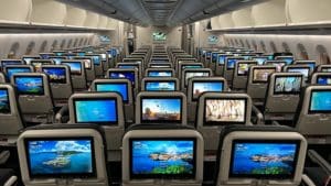 rows of seats with monitors on them