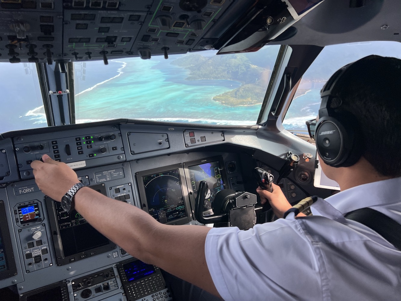 a person in a cockpit of an airplane