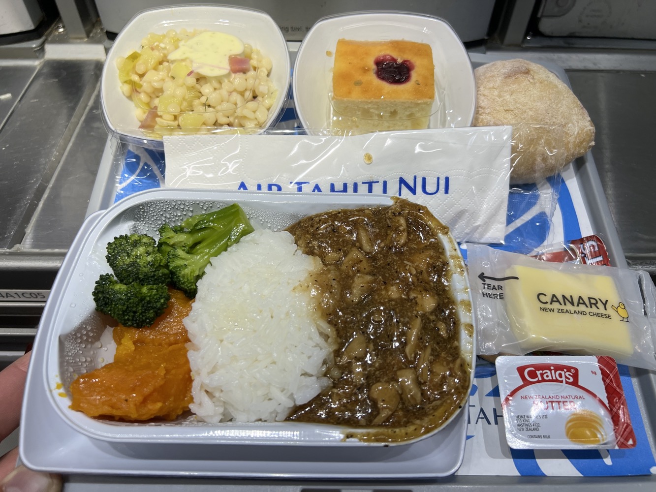 Air Tahiti Nui Economy Class meal tray. Only one choice - Black bean sauce chicken with rice
