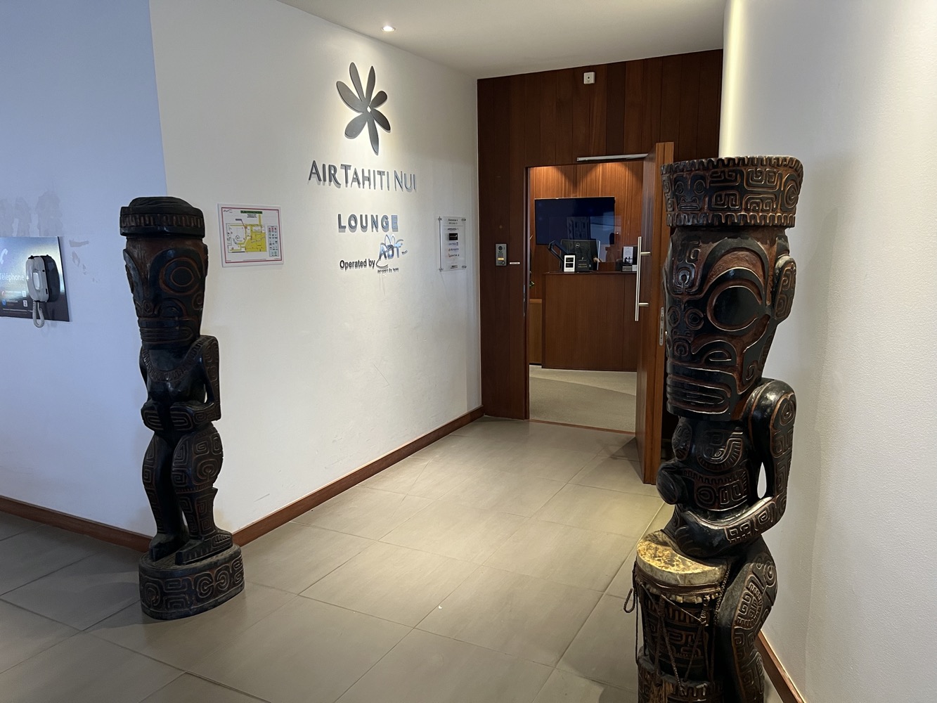a wooden statues in a hallway