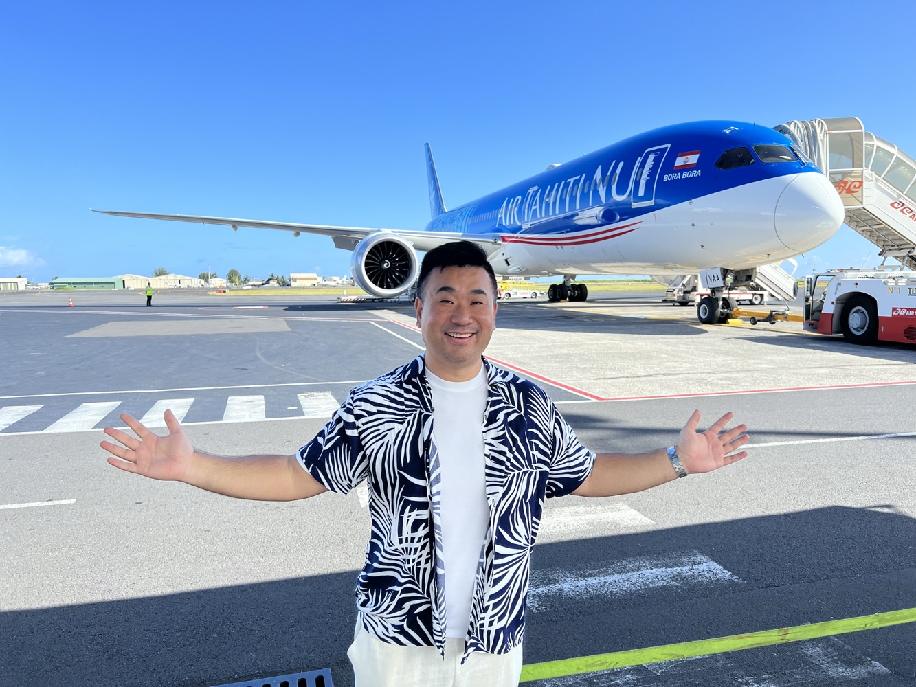 a man standing in front of an airplane