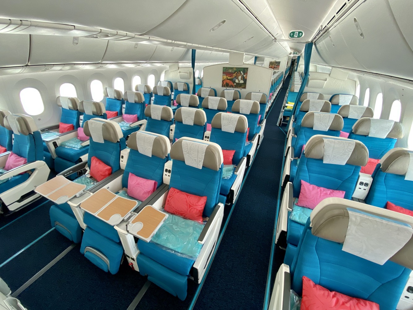 an airplane with blue seats and white seats