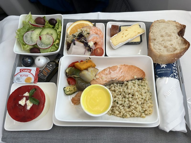 Starter, salad, main course (Salmon), dessert and cheese all on one single tray