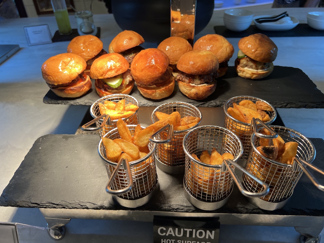 a group of burgers and fries on a table