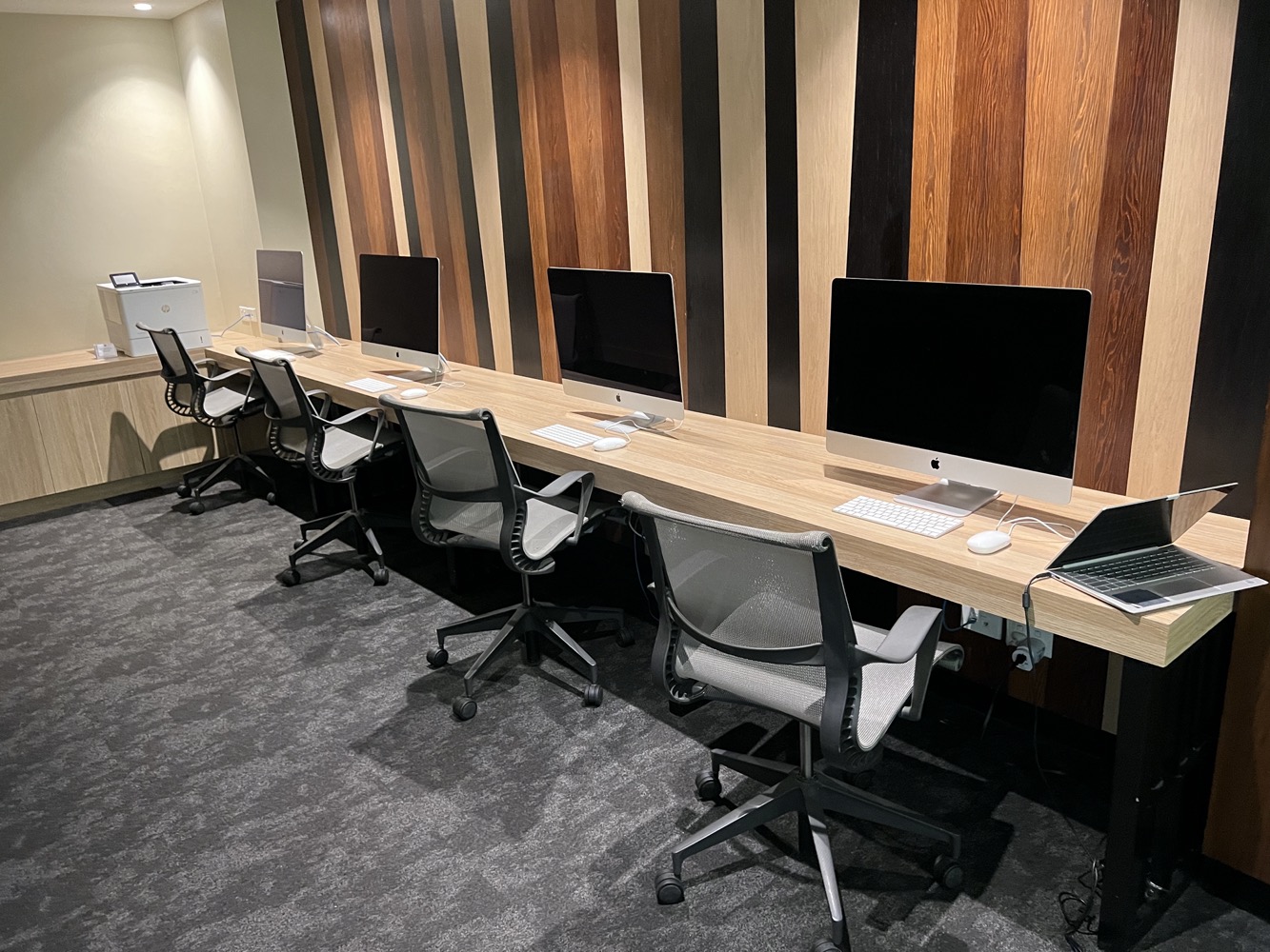 a row of computers on a table