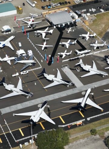 an aerial view of airplanes on a runway