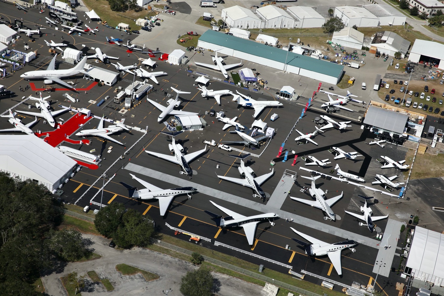 an aerial view of airplanes on a runway