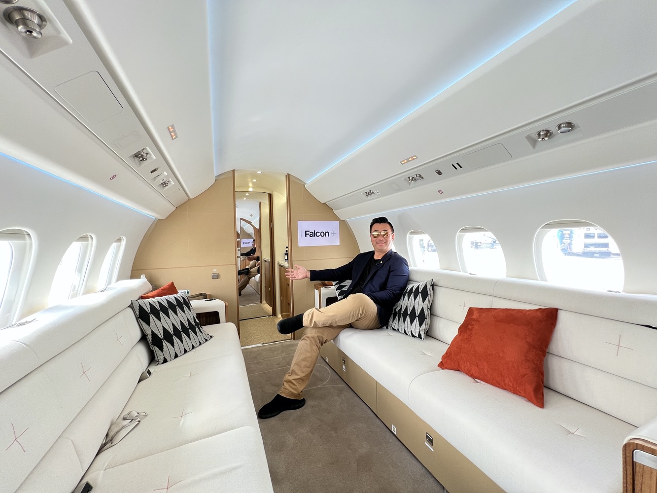 a man sitting on a couch in a plane
