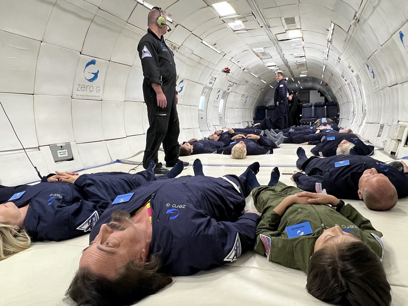 a group of people lying on the floor in a tunnel