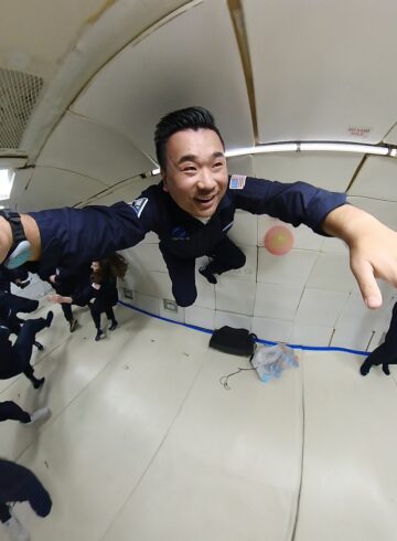 a man in uniform jumping in a room