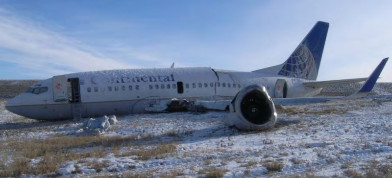 an airplane that has been crashed in the snow
