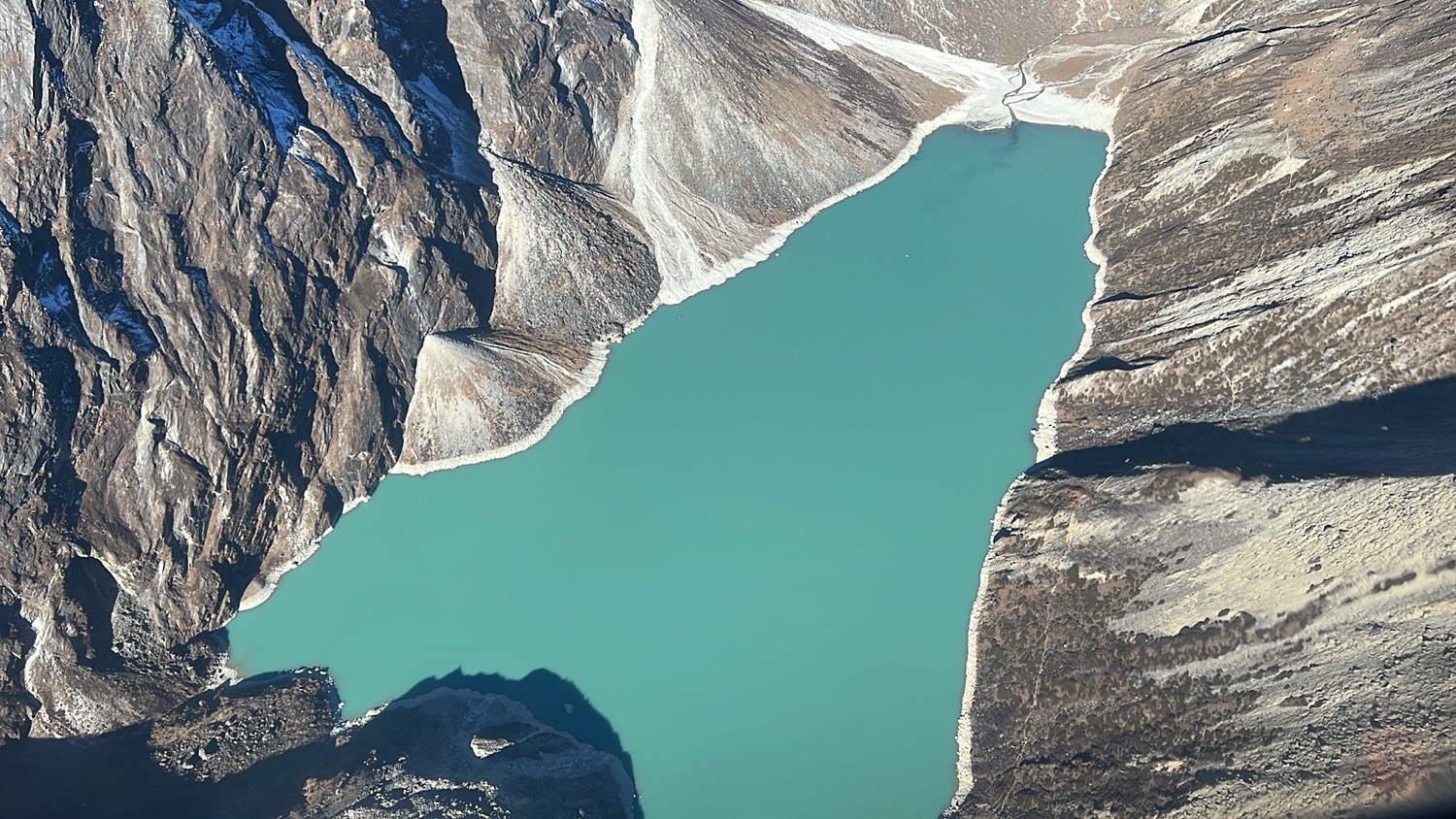 a blue lake surrounded by mountains